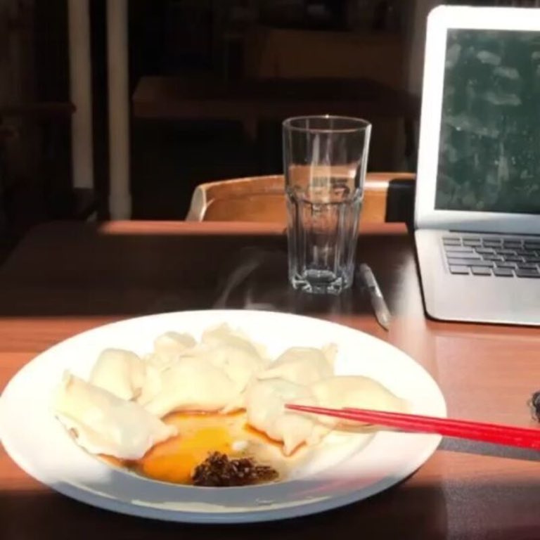 Dip and go, Steamed dumplings, chili oil, an egg, and the red chopsticks.