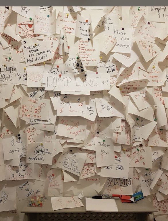 The wall of notes, Years of guests have pinned up love letters to the dumplings.