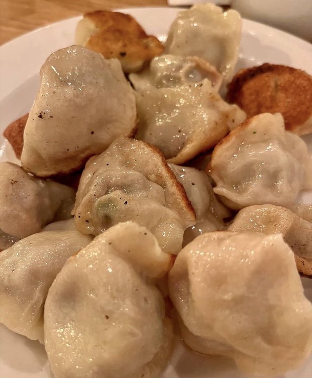 Right off the pan, Plump dumplings, glistening, with crackling golden edges.